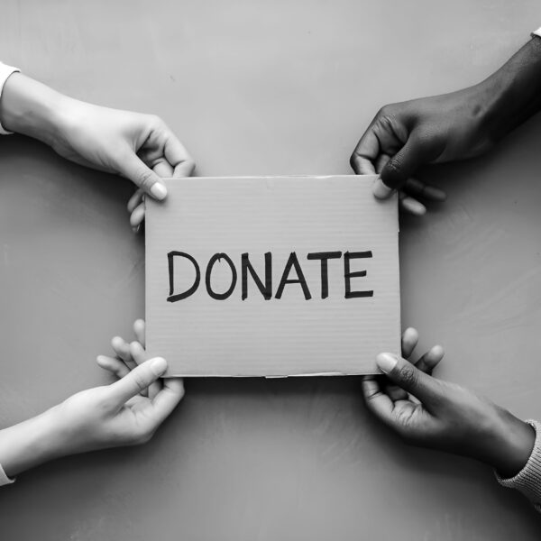 two-men-hold-sign-that-says-donation bw